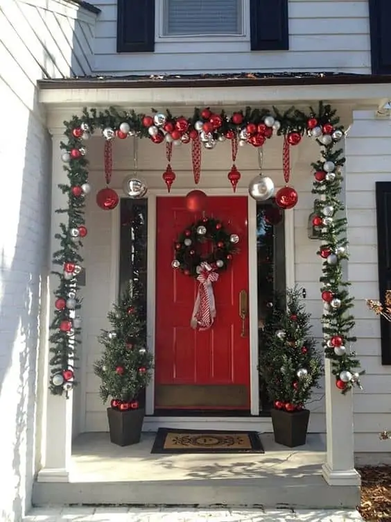 Red Door, White Porch, and Hanging Decoration