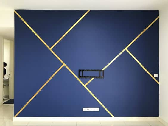 Gold stripes on entertainment wall